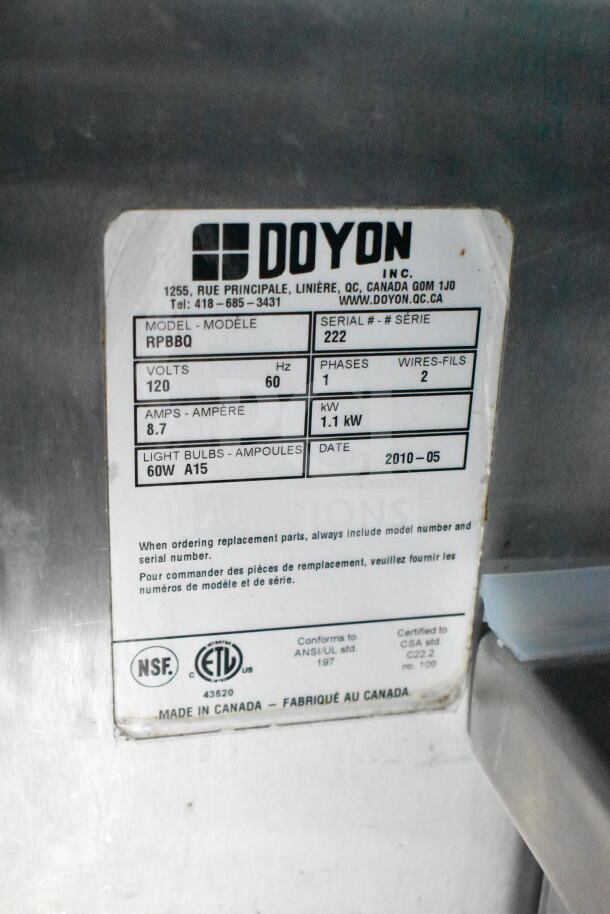 Label on a 1993 GMC Step Van, featuring Doyon model RPBBQ, serial 222. Details volts, amps, and manufacture date May 2010.