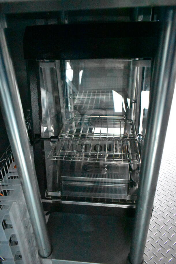 Interior view of a 1993 GMC Step Van, featuring metal shelving and diamond plate flooring, indicative of storage space.