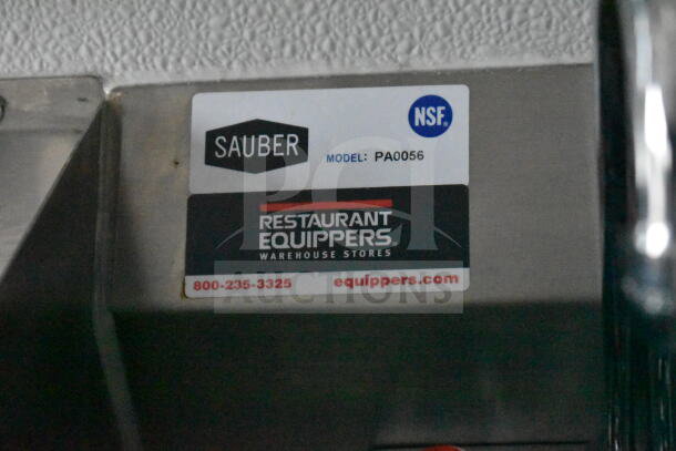 Sticker on metal surface showing "Sauber Model: PA0056" and "Restaurant Equippers" with contact info.