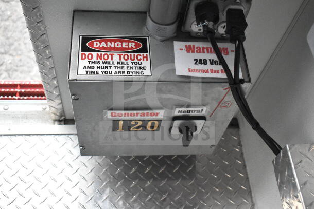 Interior view of a 1993 GMC Step Van showing a generator control panel with 120V and 240V warnings, urging caution.