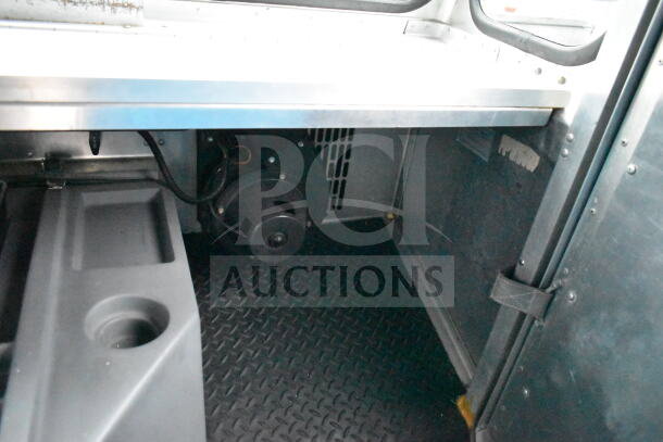 1993 GMC Step Van interior, featuring diamond plate flooring and visible machinery. Good condition, VIN 1GDHP32K7R3500033.