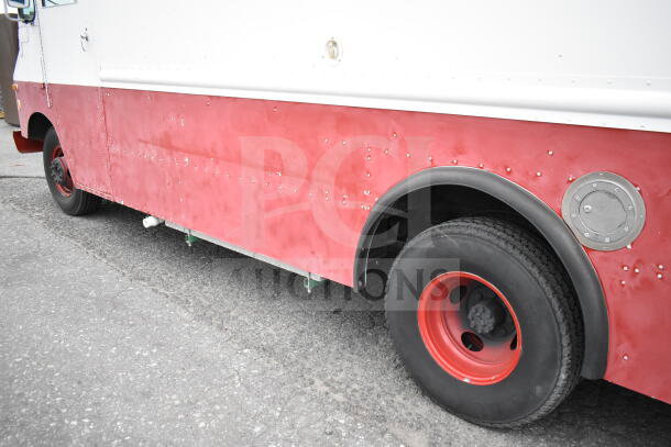 1993 GMC Step Van with red and white exterior, visible wear. VIN 1GDHP32K7R3500033. Red wheels, located outdoors.