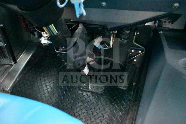 Interior view of 1993 GMC Step Van showing the driver's pedal area, wiring, and floor condition; VIN 1GDHP32K7R3500033.