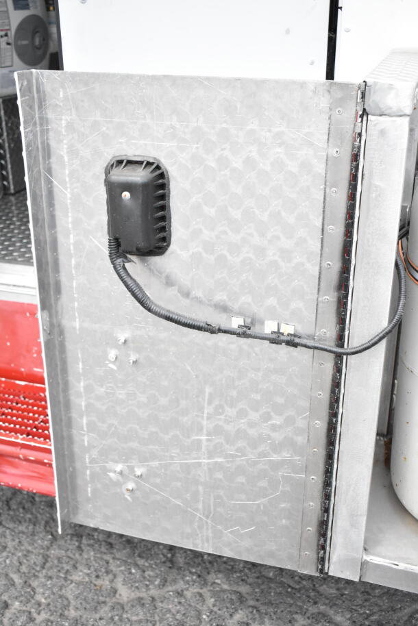 1993 GMC Step Van, VIN 1GDHP32K7R3500033, detail of exterior panel with visible wiring and metal surface condition.