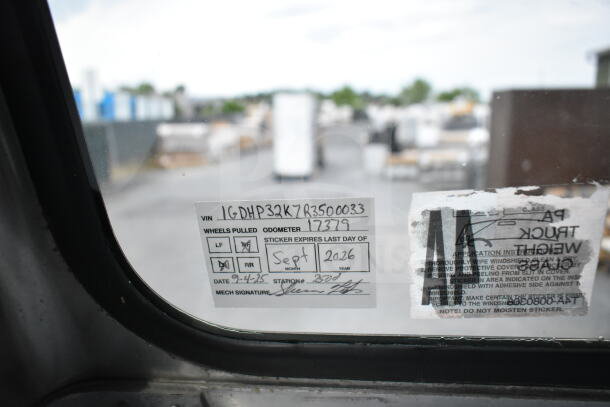 1993 GMC Step Van window sticker showing VIN 1GDHP32K7R3500033, odometer 17379, expires Sept 2026.