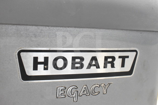 Hobart Legacy HL600 mixer logo on metal surface, highlighting brand identity on this commercial 60-quart dough mixer.