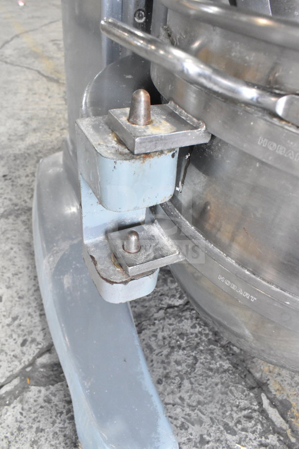 Hobart Legacy HL600 dough mixer with mixing bowl and dough hook. Features metal construction; minor wear visible.