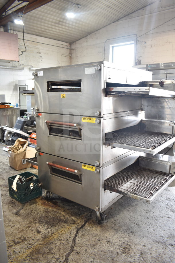 XLT XLT3240-TS conveyor pizza oven, natural gas, commercial casters, 100,000 BTU, used condition, with visible branding.
