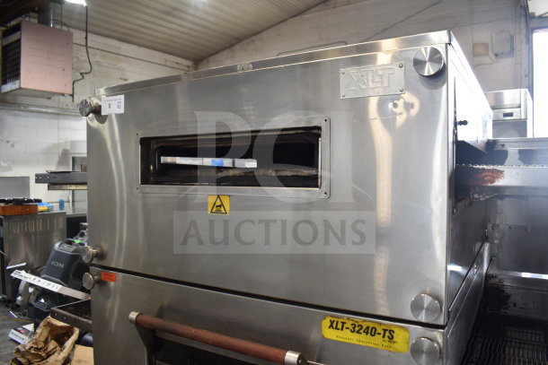 XLT XLT3240-TS commercial natural gas conveyor pizza oven, 100,000 BTU, on casters, model plate visible, industrial setting.