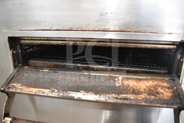 XLT XLT3240-TS conveyor pizza oven, used condition with visible wear. Natural gas powered, 100,000 BTU, on casters.
