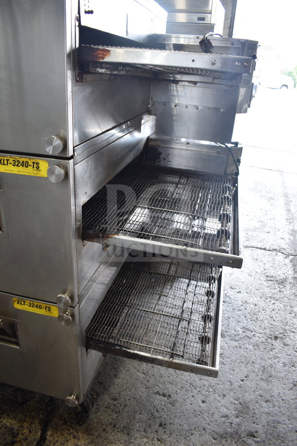 3 XLT XLT3240-TS commercial pizza ovens, natural gas, 100,000 BTU, on casters. Visible labels indicate model.
