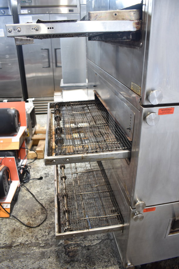 XLT XLT3240-TS commercial conveyor pizza oven, natural gas powered, on casters, 100,000 BTU, visible markings and controls.
