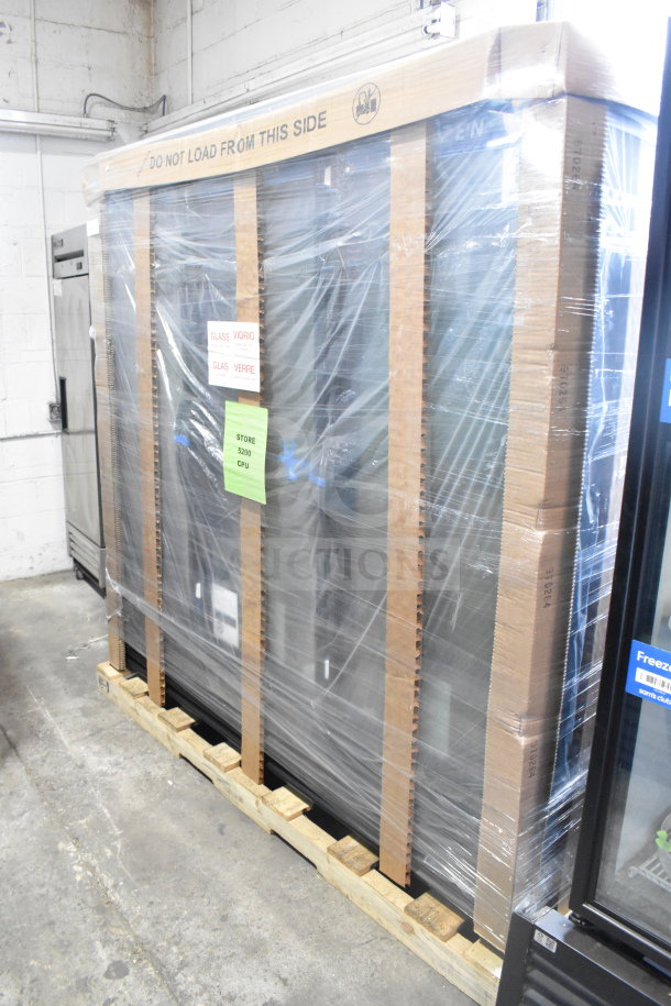 Brand new True FLM-81F 81" glass door freezer, scratch and dent, wrapped on pallet with "Do Not Load" markings.