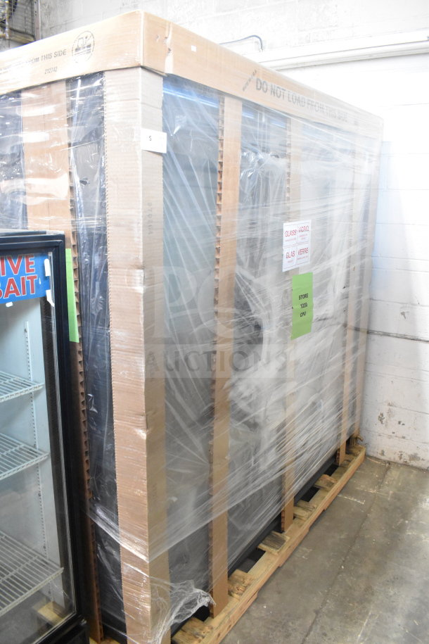 Brand new True FLM-81F 81" glass door freezer merchandiser, packaged with protective wrap; minor scratches and dents.