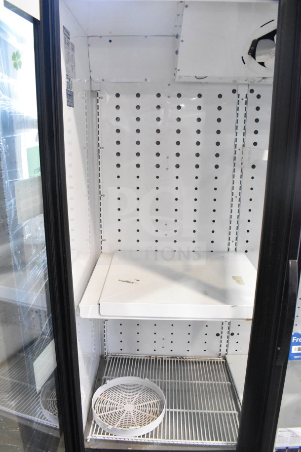 2019 True FLM-81F Commercial 81" Glass Door Freezer Merchandiser, spacious interior, minor wear, visible labels.