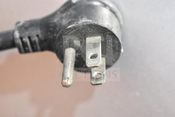 Close-up of a three-prong power plug for the 2022 True T-19F-HC freezer. Plug shows minor wear. 115 Volts, 1 Phase.