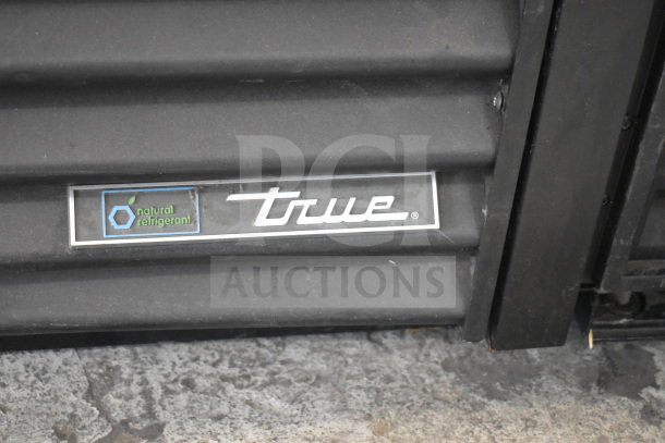 2021 True TVM-48SL-HC 2 Door Cooler, 115V, 1 Phase, natural refrigerant label, black exterior, good condition.