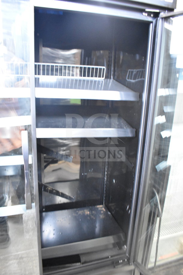2021 True TVM-48SL-HC commercial 2-door cooler, black interior, adjustable shelves, 115V, 1-phase, slightly used.