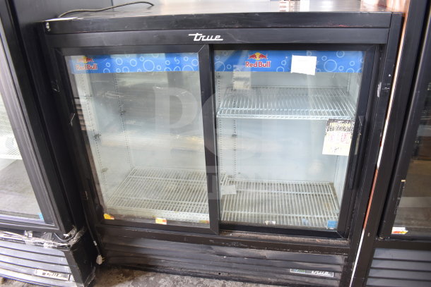 2019 True GDM-41SL-48-HC-LD commercial cooler, 2 glass doors, 115V, Red Bull branding, used condition.