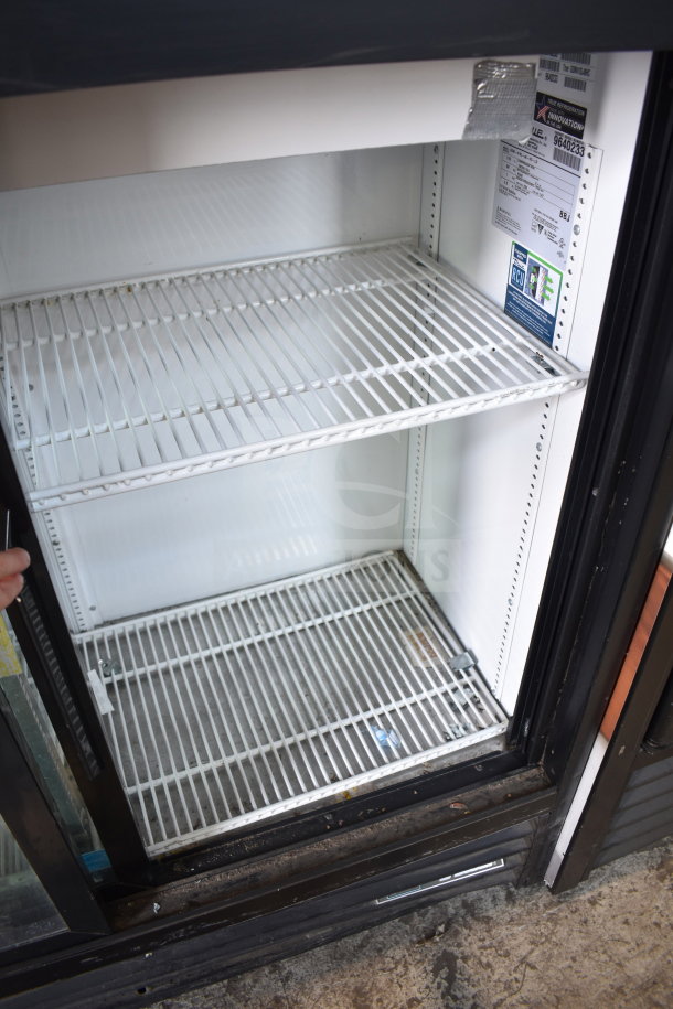 2019 True GDM-41SL-48-HC-LD commercial 2-door cooler merchandiser, white interior, wire shelves, 115V, 1 phase, good condition.