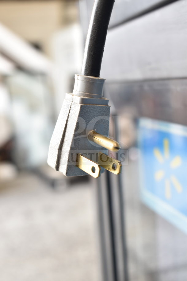 Power plug of a 2017 True GDM-41SL-48-HC-LD commercial cooler merchandiser, 115V, 1 phase, close-up detail.