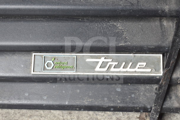 2017 True GDM-41SL-48-HC-LD cooler with natural refrigerant label, visible wear, solid design, 115V, 1 phase, dual doors.