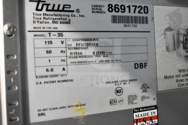 True T-35-HC Commercial Cooler label with specs: 115 volts, 1 phase, R134A refrigerant, NSF certified, made in USA.