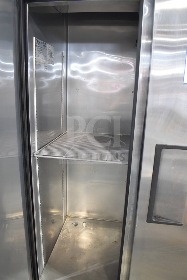 True T-35-HC commercial 2-door reach-in cooler, stainless steel, interior shelves, 115 volts, model tag visible.