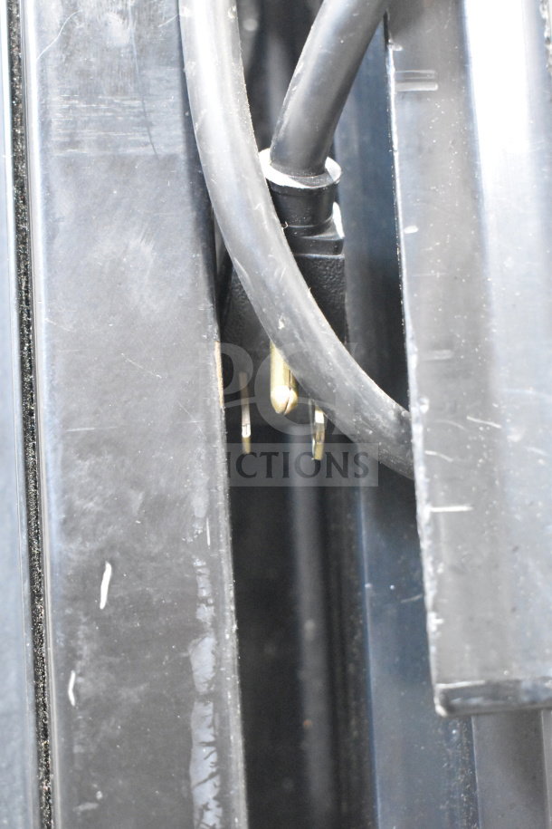 Power cord and plug of True GDM-12 Commercial Single Door Reach In Cooler Merchandiser, 115 Volts, 1 Phase.