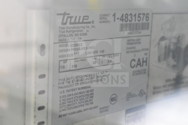 True GDM-12 commercial single door cooler label, showing model, voltage (115 V), design pressures, and NSF certification.