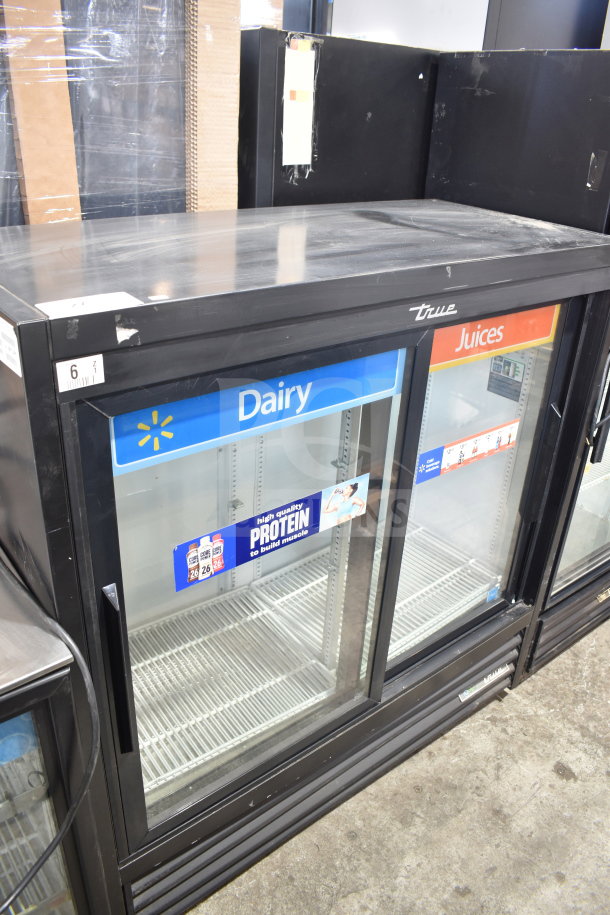 2020 True GDM-41SL-48-HC-LD commercial 2-door cooler merchandiser. Features glass doors with Dairy and Juices labels.