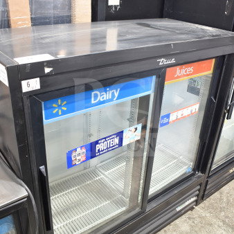 2020 True GDM-41SL-48-HC-LD commercial 2-door cooler merchandiser. Features glass doors with Dairy and Juices labels.