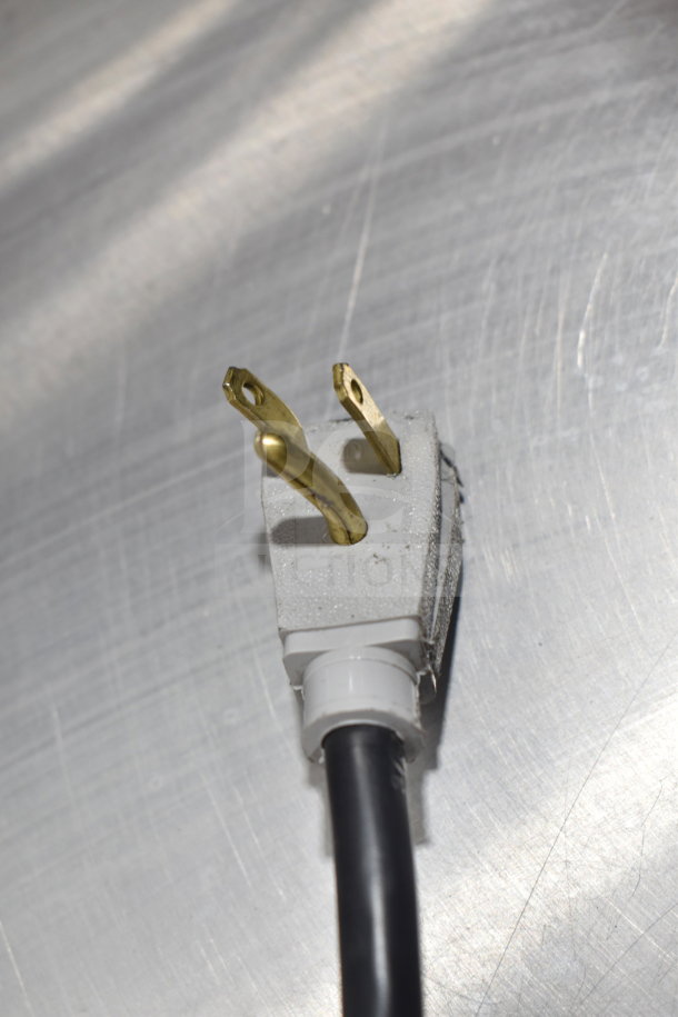 Close-up of a power plug for a 2020 True GDM-41SL-48-HC-LD cooler. Plug shows minor wear. 115 Volts, 1 Phase.