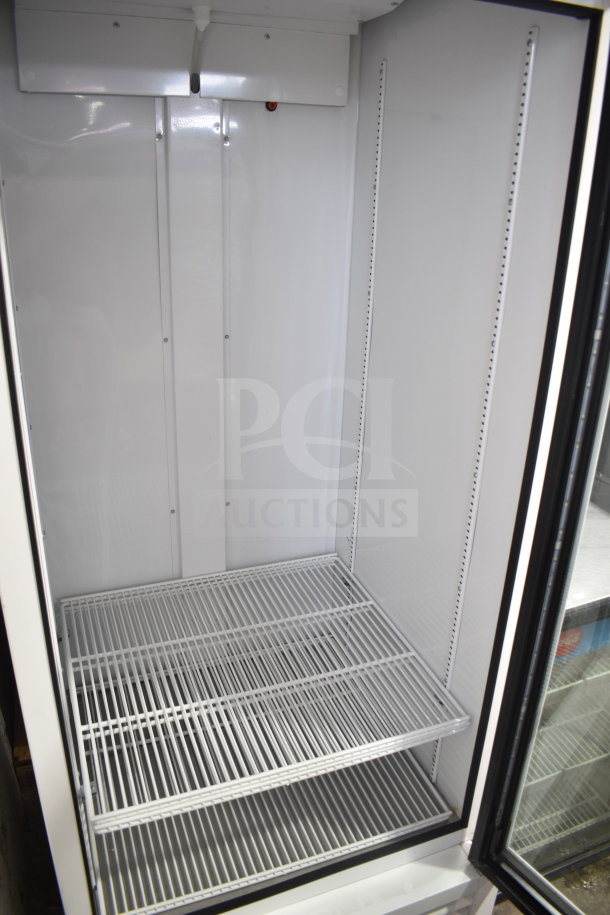 2021 True TSCI-600R-G-PH commercial single door reach-in cooler merchandiser. Features wire shelving, excellent condition.