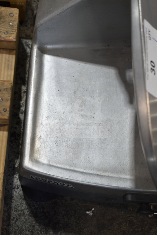 Hobart 2912 commercial meat slicer, countertop model, 120V, 1 phase. Visible surface wear, Hobart logo shown.