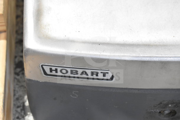 Hobart 2912 commercial countertop meat slicer, stainless steel, visible Hobart logo, 120 volts, 1 phase, used condition.