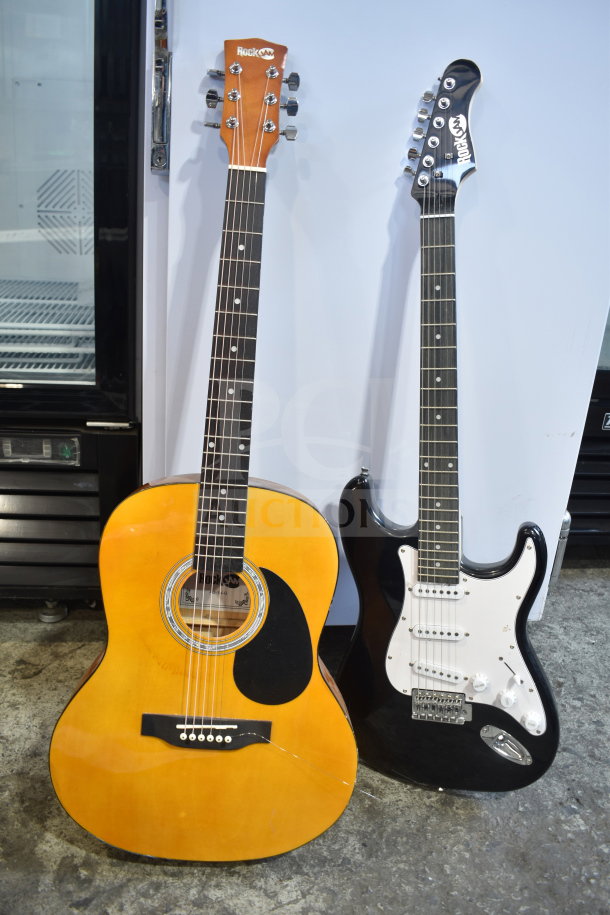 Two Rock Jam guitars, one acoustic with a natural finish and one black electric, both in good condition.