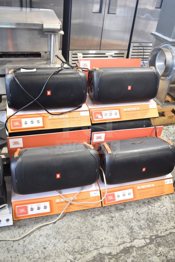 Set of six JBL PartyBox 110 Portable Bluetooth Party Speakers on display; condition appears gently used.