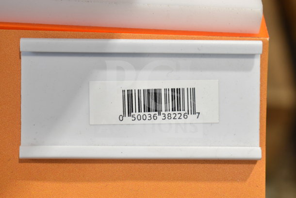 Barcoded label on display stand for JBL PartyBox 110 Portable Bluetooth Speaker. White and orange background.