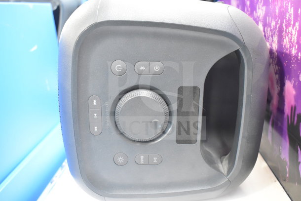 Onn Medium Party Speaker with control panel featuring power, volume, and playback buttons. Used condition, store display item.