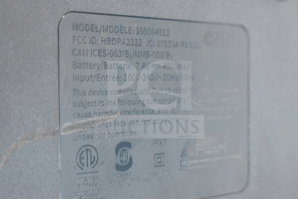 Label on the Onn Medium Party Speaker model 100094812, showing battery, input, and compliance details.