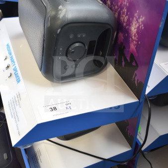 Onn Medium Party Speaker display, showing speaker controls and connectivity ports on a blue shelf.