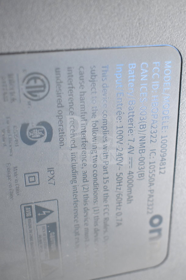 Onn Medium Party Speaker label showing model 100094812, battery 7.4V 4000mAh, IPX7 rating, and compliance markings.