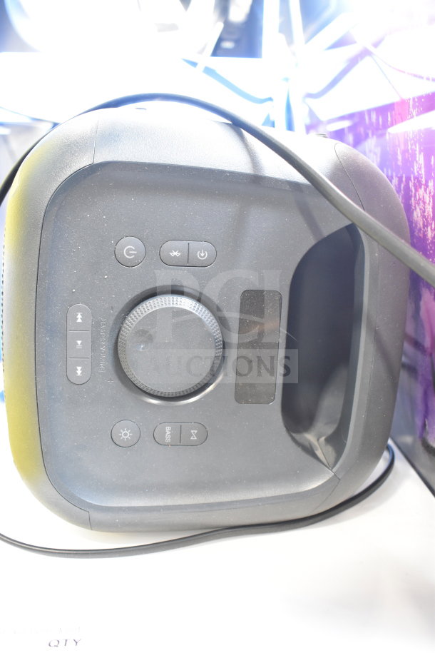 Onn Medium Party Speaker on display, featuring control buttons and knobs on the top panel. Lightly used condition.