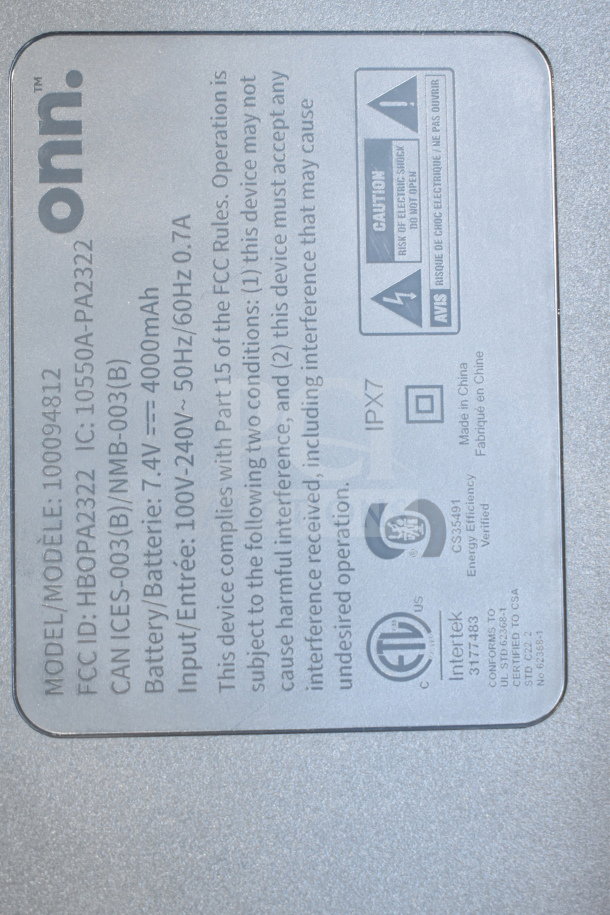 Onn Medium Party Speaker with label showing model HBOP2322, IPX7 rating, and battery details. Store display condition.