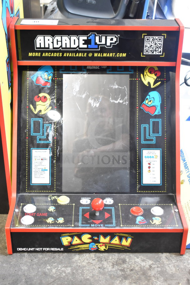 Arcade 1UP PAC-A-501030 Pac Man Machine, classic design, minor surface wear, functional controls, vibrant graphics.