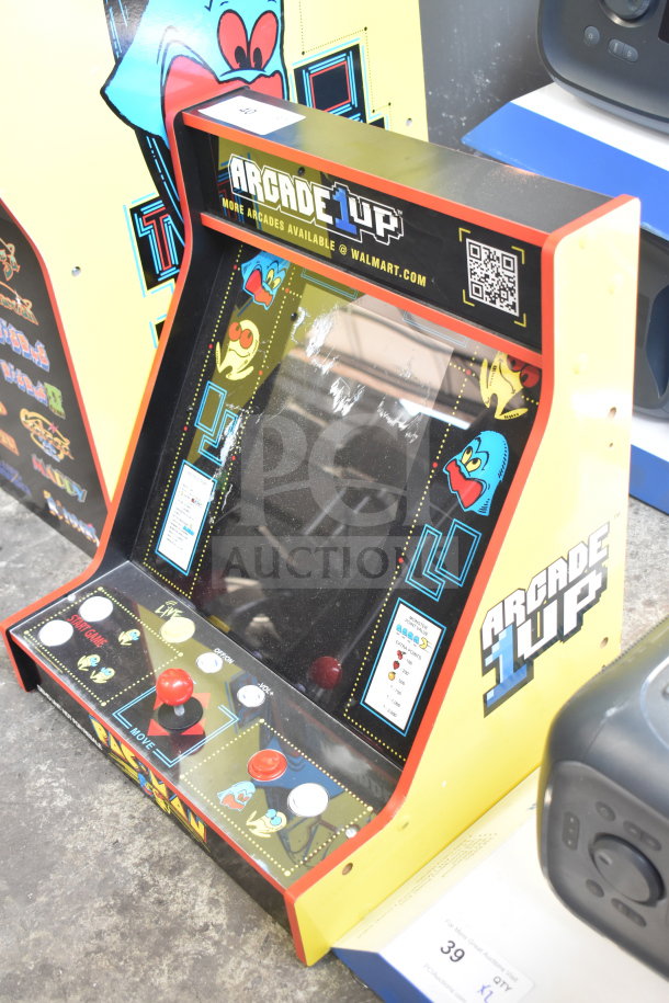 Arcade 1UP PAC-A-501030 Pac Man Machine, featuring vibrant graphics, joystick, buttons; good condition.