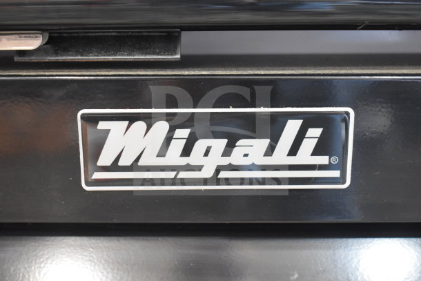 Migali C-12RM-HC cooler merchandiser, single door, commercial casters, new scratch and dent, logo detail shown.