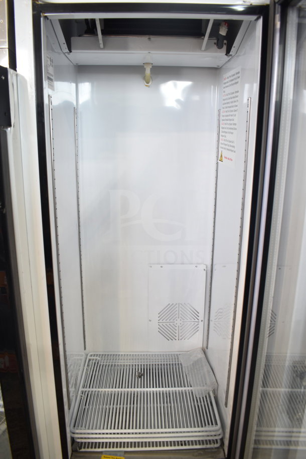 Brand new 2018 Migali C-12RM-HC commercial cooler, single door, on casters, 115V, 1 phase, visible interior shelving.