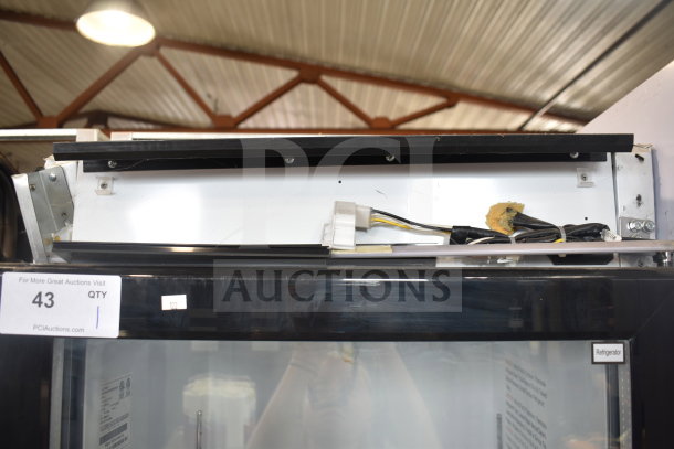 Migali C-12RM-HC single door cooler merchandiser with visible wiring and commercial casters. Tag displays auction number 43.